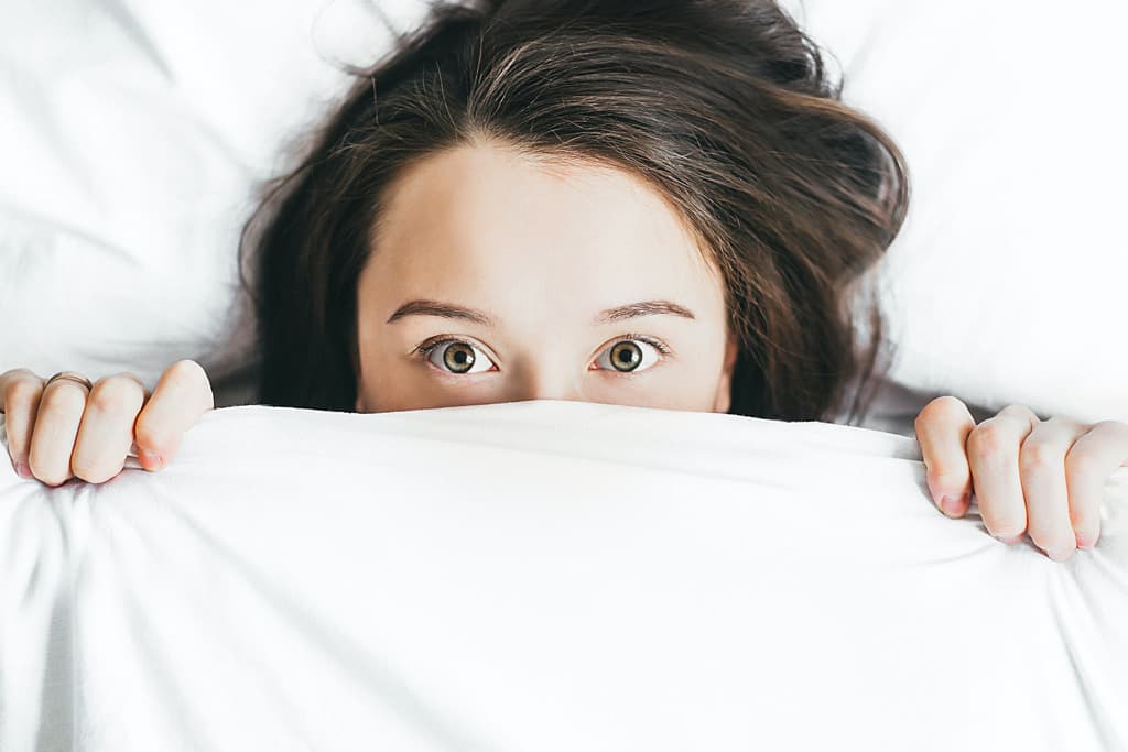 A woman in bed.