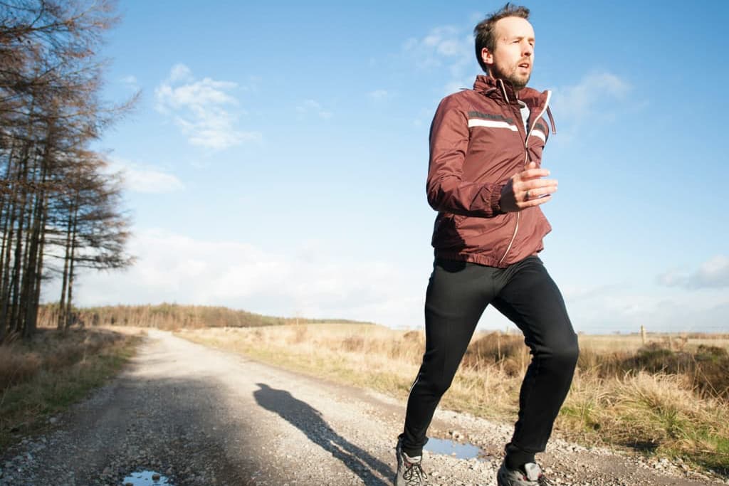 Man running outside in the morning.