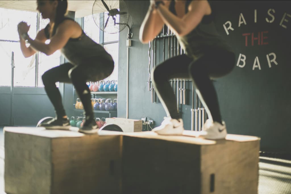 Women doing jump squats.